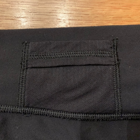 Black Lululemon athletic shorts. - Picture 4 of 7